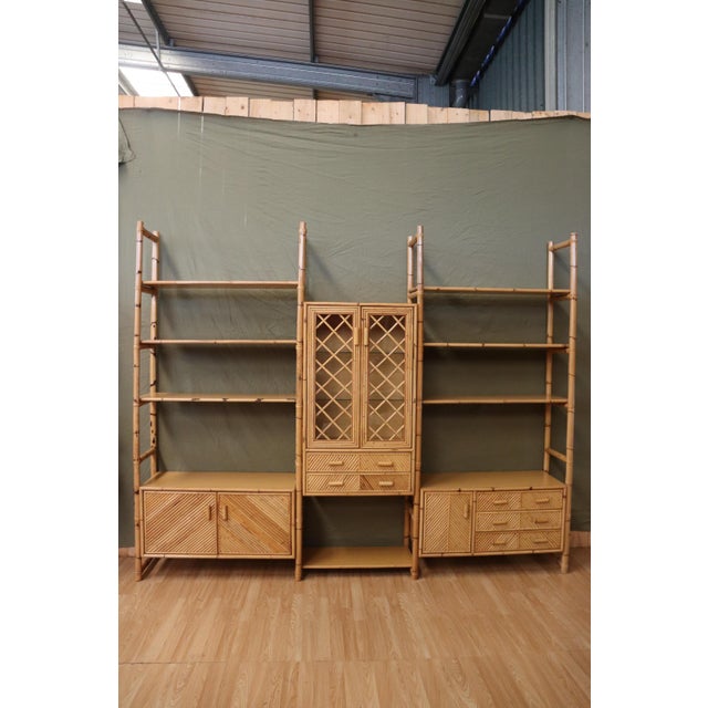 Large rattan and bamboo shelving unit/bookcase. from the 1960s. Made in Italy. Very high quality craftsmanship. Features...