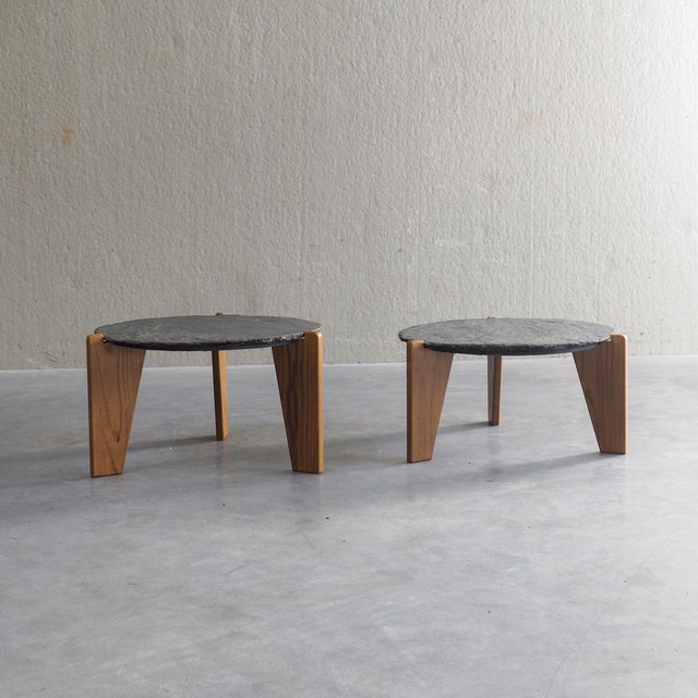Elegant set of of 2 side tables. Each piece features a thick, rugged natural slate tabletop. The cool dark slate contrasts...