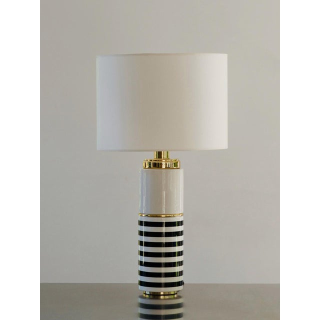 "She passes, we remain silent." Inspired by the nine Greek Muses, guardians of the arts and sciences, this lamp embodies...