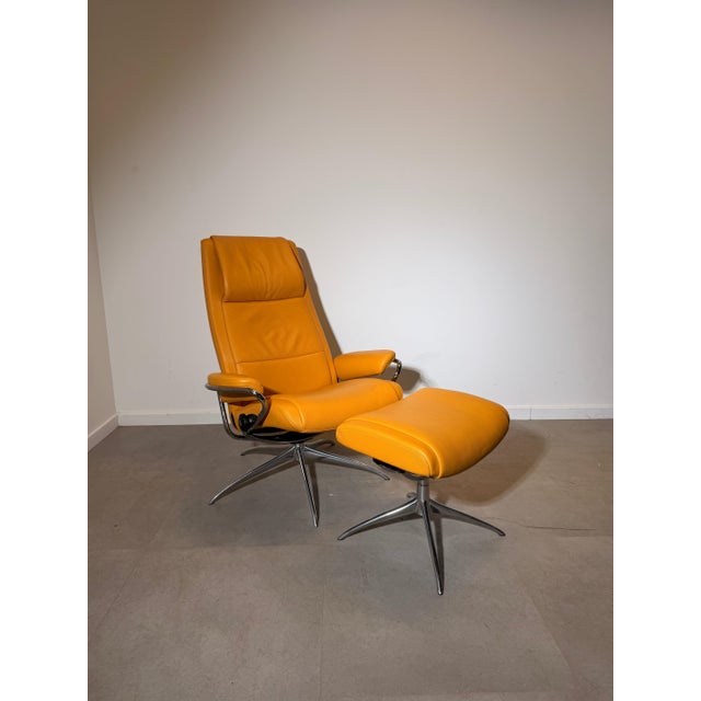 A stylish stressless city recliner with matching ottoman, finished in beautiful mustard yellow leather. The city model...