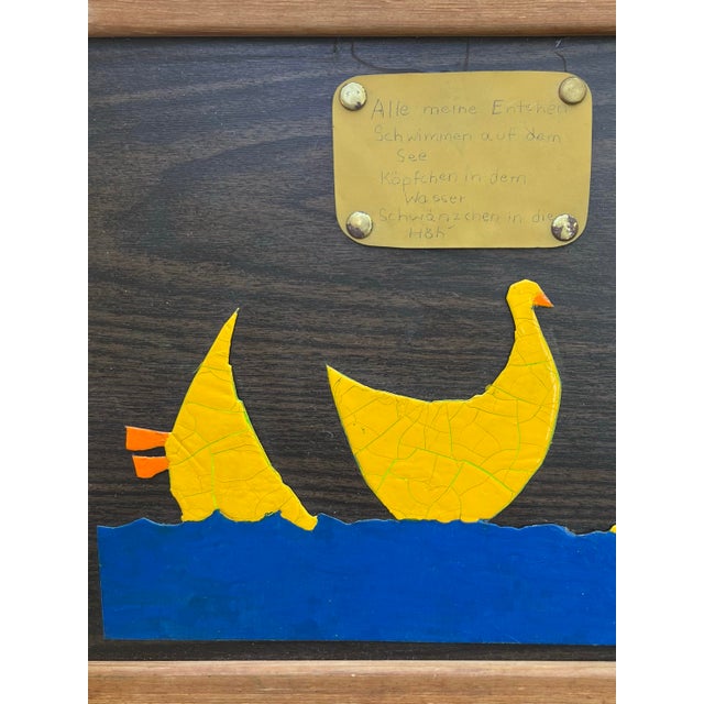 A sweet piece of naive folk art illustrating "Alle meine Entchen," the beloved German children's song. Three cheerful...