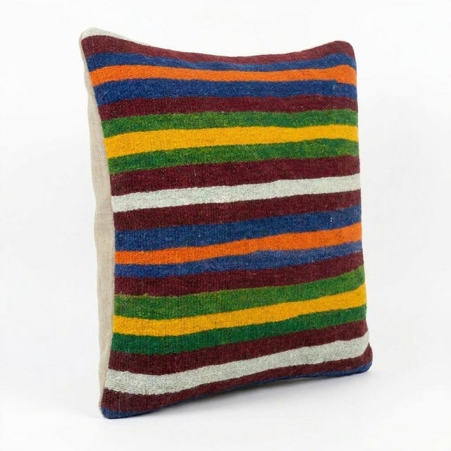 This beautiful 20'' x 20'' pillow cover was made from an authentic Turkish rug. Bright colors of wool adorn the front of...