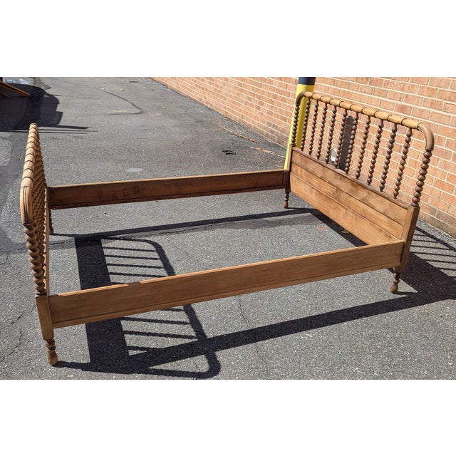 Bring timeless charm to your bedroom with this authentic Antique Jenny Lind Spool Bed! This full-sized wooden bed frame...