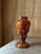 This Antique Bohemian Kralik baluster vase is a striking example of multicolored splatter glass, executed in the...
