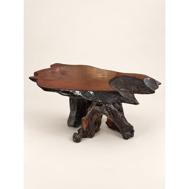 Vintage redwood burl coffee table with a freeform live-edge top and natural root base. The rich grain and sculptural shape...