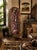 An extraordinary hand-carved chair crafted by artisans in Malawi, showcasing a richly detailed panorama of African...