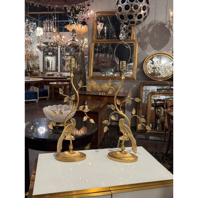 This product is a pair of vintage French Maison Bagues style glass bird lamps. These lamps feature intricate designs of...