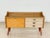 For sale is a stylish mid-century lowboard from the 1960s. This piece of furniture impresses with its clean lines, elegant...