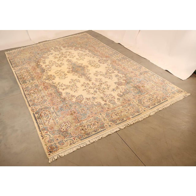 High Quality Hand Tied 11' x 18' Fringed Area Rug. Rug Features Cream Center Medallion Surrounded by Smaller Motifs. The...