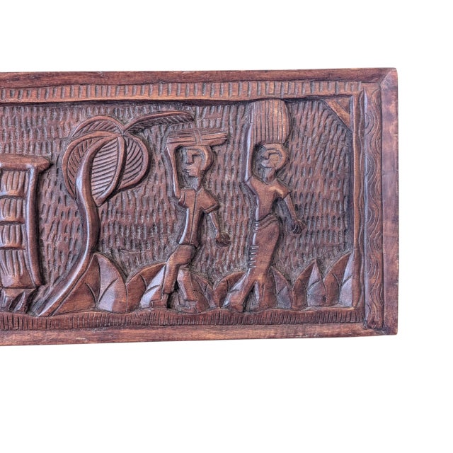 Lovely example of West African folk art in the form of this vintage hand-carved wall panel. The carving depicts a farm and...