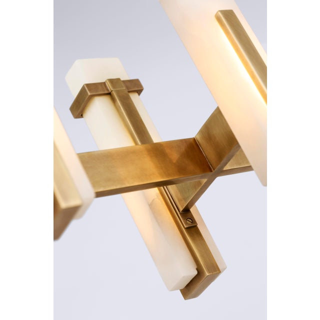 Malik Large Linear Chandelier in Hand-Rubbed Antique Brass with Alabaster Designer: Ian K. Fowler Fixture Height: 15.5"...