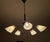 A stylish 5-armed chandelier that evokes the modern design of the 1950s and 1960s. The sputnik ceiling lamp features a...