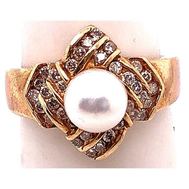 14 Karat Yellow Gold Pearl Solitaire With Diamond Accents Ring 50 piece of round diamonds with 1.00 total diamond weight....