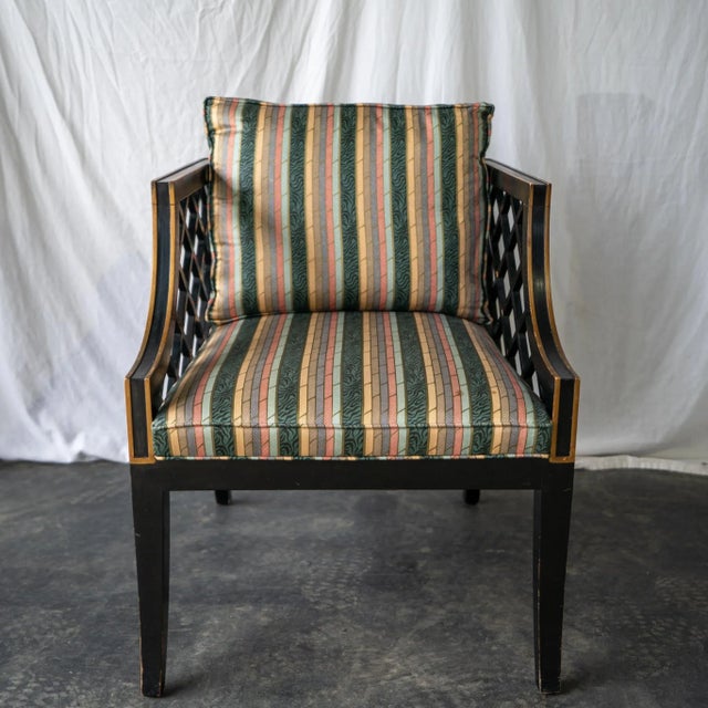 Pair of Mid-century modern (some might say Hollywood Regency) armchairs with striped cushion, seat and back. Sloping arms...