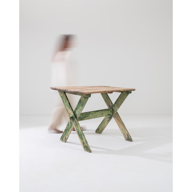 Transform your space with the alluring charm of this 1900s French Wooden Table featuring elegant X-legs. Crafted with...