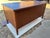 The Vintage Leopold Desk is a stunning piece of mid-century modern furniture made of wood and has a drawer for files With...