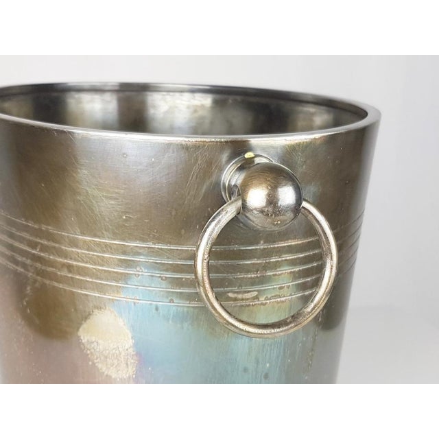 Silver plated metal Ice bucket by Christofle. Manufacture mark on the base. Very good condition. This piece has an...