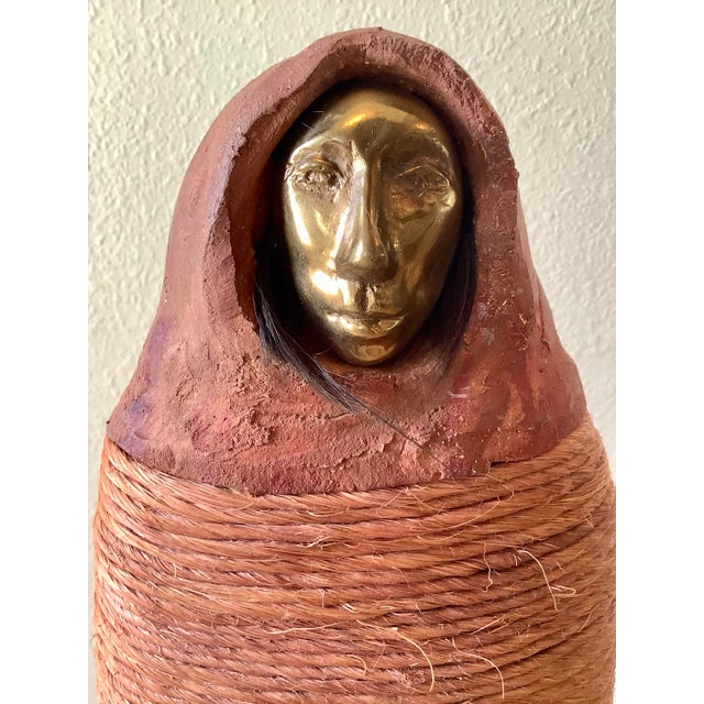 A striking mixed media figurative sculpture by American artist Naida Seibel, signed and created as part of a cohesive...