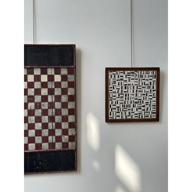 Vintage Black + White Glazed Ceramic Tile Artwork in Teak Frame, Circa 1950s. Each small square tile is glazed white with...