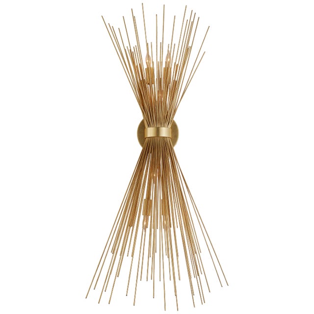Strada Large Sconce in Gild Designer: Kelly Wearstler Height: 36" Extension: 8" Backplate: 5" x .5" ROUND Mounting:...