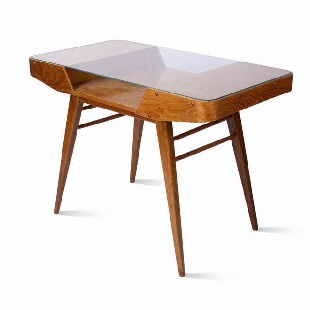 Wooden coffee table produced in the 1950s by Tatra nábytek Pravenec and designed by František Jirák. The table is made of...