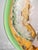 This designer vase is made of brightly colored glass with shades of green, blue, pink, and yellow. This beautiful harmony...