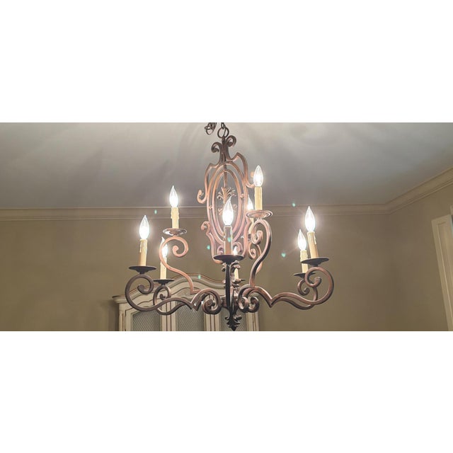 Spanish revival formal dining chandelier with flour de lis accents. Used but in perfect condition.