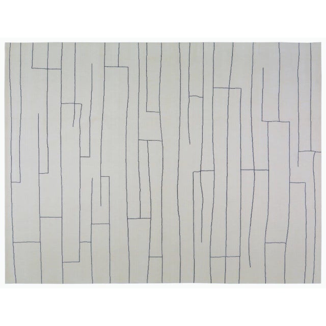 Hand-knotted with care using traditional rug-making techniques, this wool rug blends timeless craftsmanship with a modern...