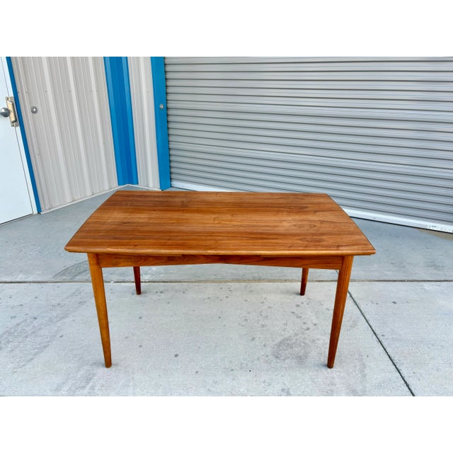 Danish modern extendable teak dining table was designed and manufactured in Denmark 1960s. This exquisite dining table...