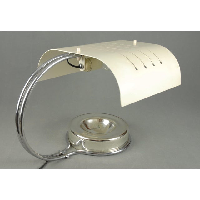 A rare and highly sculptural table lamp produced by Stilnovo, Milan, during the late 1950s to early 1960s. The design...