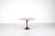 120 cm "Tulip" dining table with round wooden top and black base. Designed by Eero Saarinen for Knoll International in...