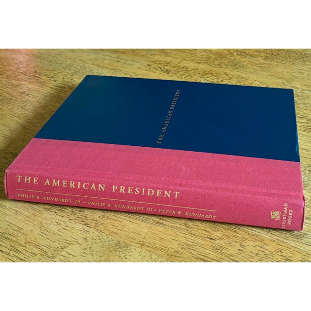 Beautifully bound hardcover copy of The American President, published in 1999. Covered in red and navy blue with gold...