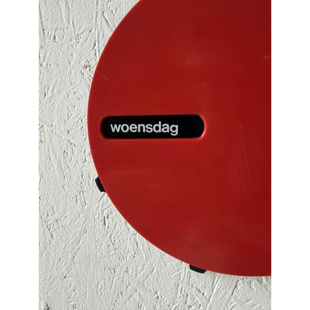 A distinctly Italian wall calendar from the 1970s, manufactured by Grafica Gasperini Verona. The round red casing, the...