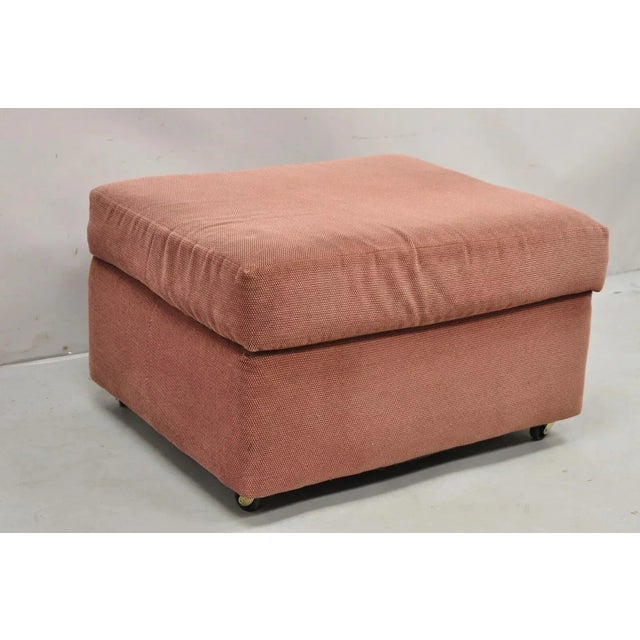Vintage Thayer Coggin Modern Upholstered Mauve Color Ottoman Footstool on Wheels. Age: Late 20th Century. Measurements:...