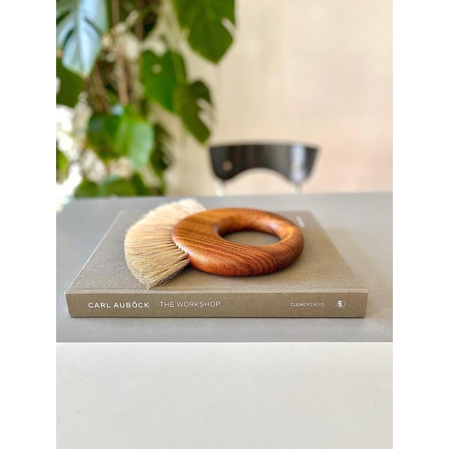 A beautiful large ring-shaped modernist wall-hung coat rack clothes brush from the 1950s. Designed and manufactured by...