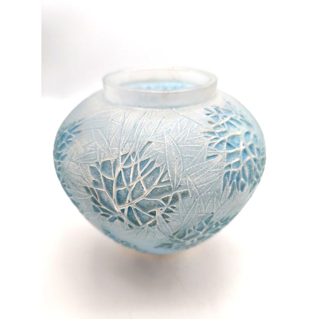 A fine cased opalescent glass vase model "Esterel". Designed by René Lalique and manufactured in his workshop in Wingen-...