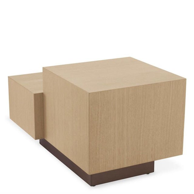 This side table features a square block and a rectangular block set on a right-angled base, giving the piece a cubist-...