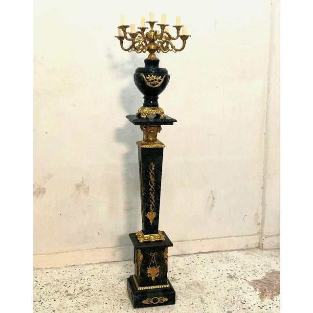 Add a dramatic touch of French-inspired elegance to your interior with this striking black pedestal and decorative vase...