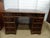This Vintage Mahogany Pedestal Desk is a beautifully crafted piece of furniture from the mid-20th century. Made from wood...