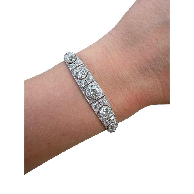 This stunning bracelet from the Art Deco era consisting of a 2.00 carat center old European cut diamond and 82 old...
