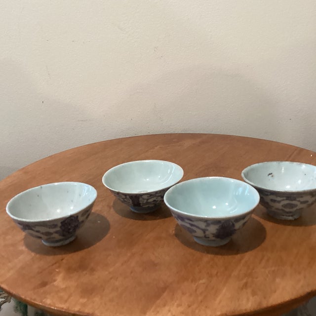 This is assorted four antique Chinese blue and white porcelain tea bowls or rice cups, with maker marks indicating their...