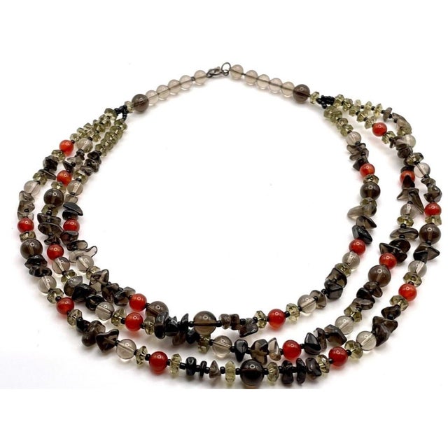 Smoky Quartz in both smooth round beads and freeform polished chip/tumble shapes with clear balls of quartz and orange...