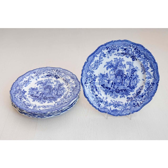 Six English blue and white transferware dinner plates from the 19th century, with Gothic ruins motifs, sold individually....
