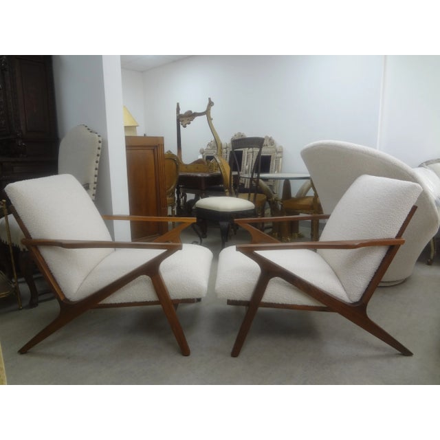 Pair of French Mid-Century Modern Jeanneret Style Lounge Chairs. These stunning French Modernist lounge chairs are an...