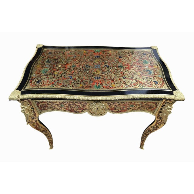 Elegant and richly detailed French Boulle-style side table, dating to the 19th century, featuring exquisite hand-cut brass...