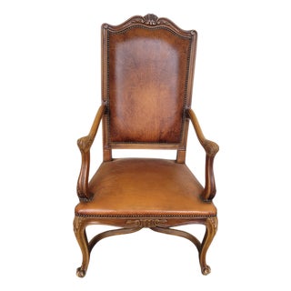 French Louis XV Style Carved Walnut and Patinated Leather Armchair, 1920s For Sale