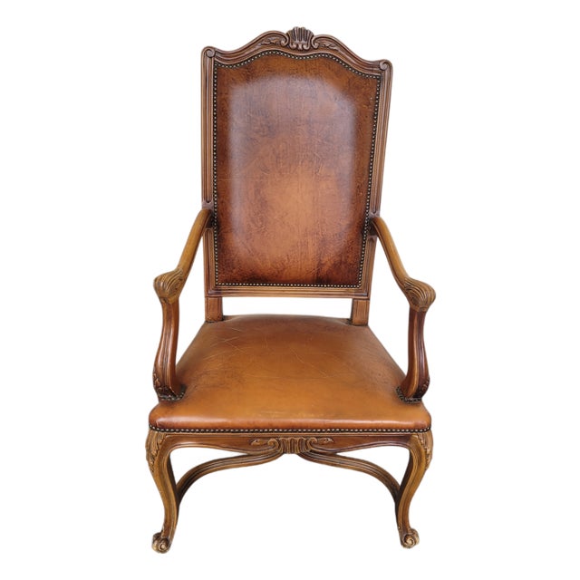 French Louis XV Style Carved Walnut and Patinated Leather Armchair, 1920s For Sale