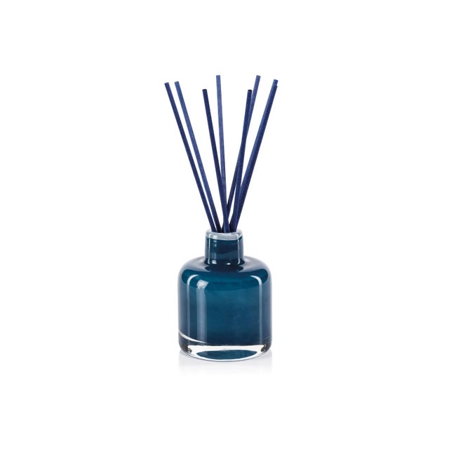 Our sophisticated Bottled Reed Diffuser adds a fragrant and comforting aroma to your favorite space! Glass vessel donned...
