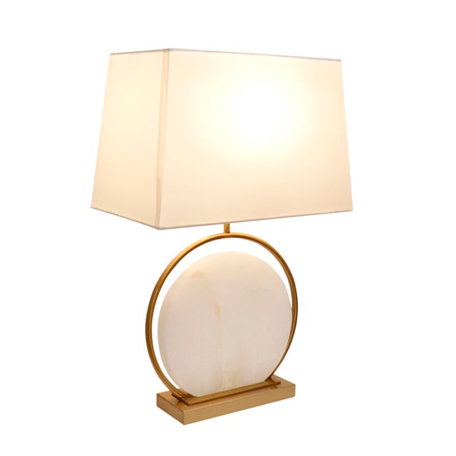 Visually breathtaking this contemporary table lamp is composed of marble affixed to a gold metal base, further accentuated...