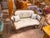 French Louis XV style canapé settee, beautifully crafted with an elaborately carved frame, rich gold finish, and elegant...